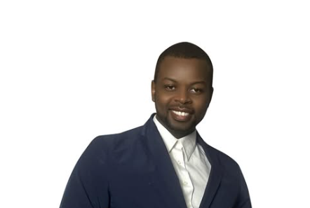 Professional business headshot of Author Jeff Calixte (Mc Yow-Z) smiling in a navy blazer on a white background.